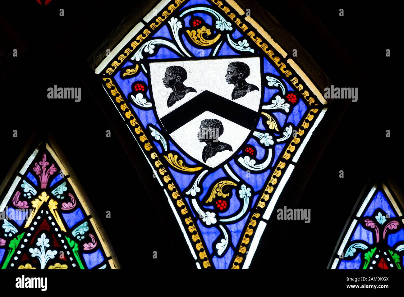Ives family arms stained glass, three Moors heads, St. Martin`s Church